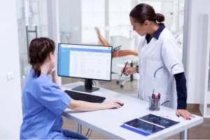 Healthcare providers discussing about the Difference Between EHR and EMR