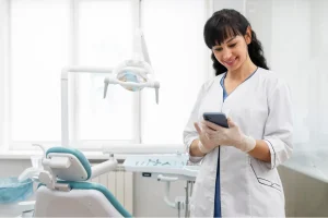 Dental professional reviewing payment records, illustrating Accounts Receivable process in dental practices.
