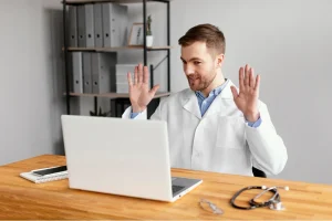 Doctor conducting a telehealth visit, illustrating Modifier 93 vs 95 usage for audio-only and audio-visual telemedicine billing.