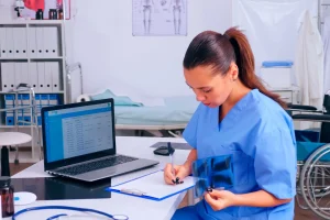 Healthcare professional reviewing patient records and X-rays, illustrating PR-227 denial code in medical billing